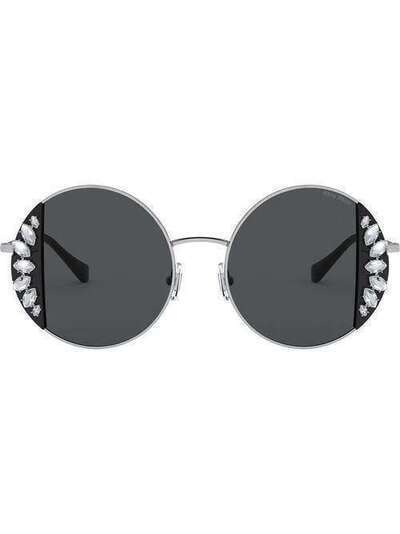 Miu Miu Eyewear солнцезащитные очки Noir в круглой оправе SMU57VC049E01E